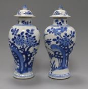 A pair of Chinese blue and white vases and covers, kangxi period Height 26cm