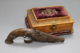 A Percussion cap pistol and a casket