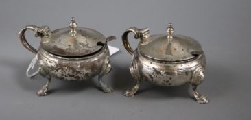 A pair of 1960's silver mustard pots and two associated silver spoons.