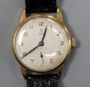 A gentleman's 9ct gold Tudor manual wing wrist watch, with subsidiary seconds, on later associated