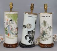 Three cylindrical Chinese lamps on stands