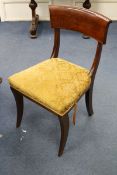 A set of seven George IV mahogany dining chairs