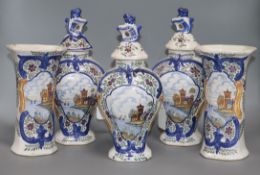 A set of three Delft polychrome-decorated jars and covers and a pair of similar vases, all painted