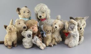 Thirteen soft toys: dogs, cats, monkey, 1930's-50's, tallest 10in.