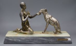 A Deco silvered metal figure of a lady with dog marked Ruffony