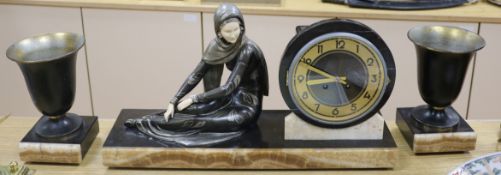 A Deco bronzed metal figural clock garniture