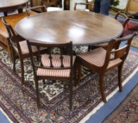 An oval mahogany dining table and six Regency-style chairs W.143cm