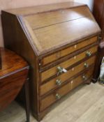 A Georgian oak bureau with mahogany banding and some damage, circa 1825 W.100cm