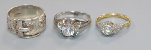 An 18ct gold, platinum and illusion set solitaire diamond ring, a 9ct white gold ring and a white