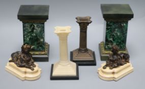 A pair of plinths, pair of bookends, pair of candlesticks