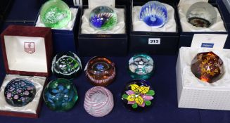 Twelve paperweights including Caithness