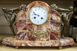 An Art Deco French rouge marble mantel clock