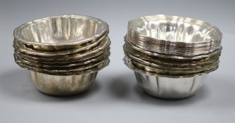 A set of six Italian 800 white metal petal rimmed deep bowls and a set of twelve similar plated