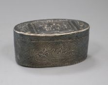 An 18th century French embossed oval white metal snuff box, decorate with trellis work and panels of