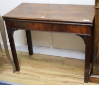 A Georgian mahogany card table with concertina action W.91cm