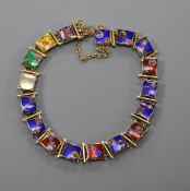 An early 20th century 9ct gold and enamel bracelet, decorated with flags of different countries