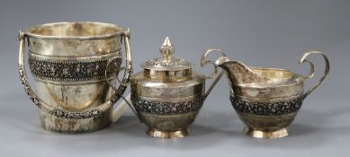 Three items of Burmese 900 white metal by Paung, including an ice bucket, a cream jug with