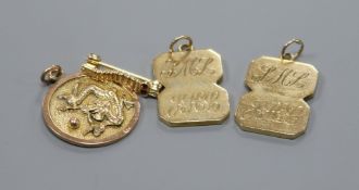 A Chinese 14k gold pendant, two 9ct gold pendants formed from cufflinks and a yellow metal "