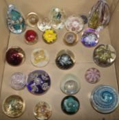 A collection of glass paperweights