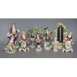 Eight porcelain figures and a floral encrusted thermometer