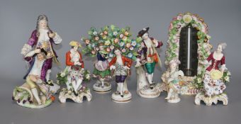 Eight porcelain figures and a floral encrusted thermometer