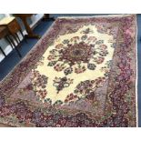 A Kirman red ground carpet, 355 x 243cm