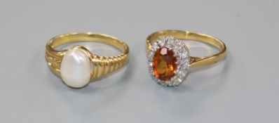 Two 18ct gold and gem set rings including baroque pearl and citrine and diamond.