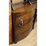 A reproduction four drawer bowfront chest with brushing slide W.76cm