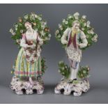 A pair of Chelsea porcelain figures of a gallant and companion