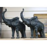 A pair of cast iron elephants height 37cm