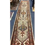 A Hamadan ivory ground runner 425 x 95cm