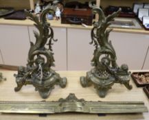 A Louis XV style cast brass rococo kerb and two fire dogs height 47.5cm