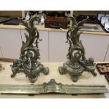 A Louis XV style cast brass rococo kerb and two fire dogs height 47.5cm