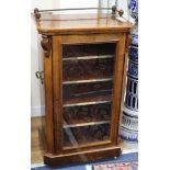 An Edwardian walnut music cabinet W.54cm