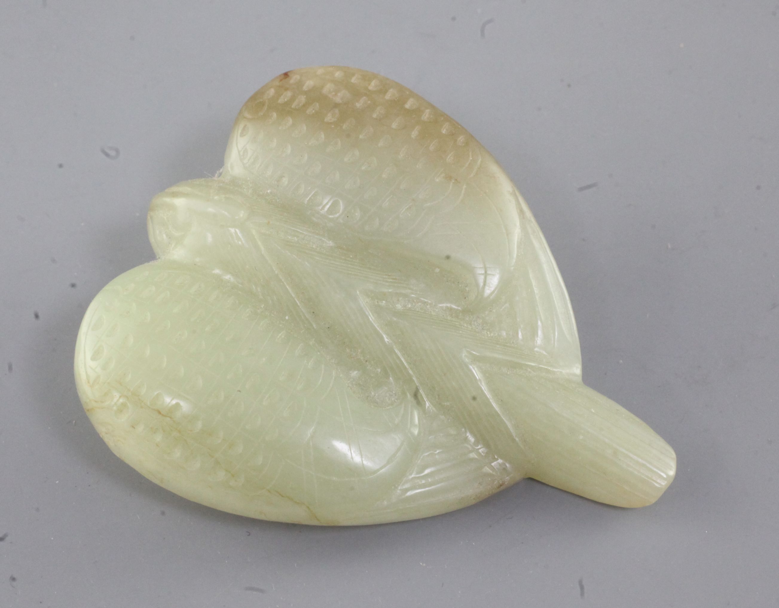 A Chinese yellow and russet jade carving of a falcon, Eastern Zhou dynasty or later, the stylised - Image 2 of 2
