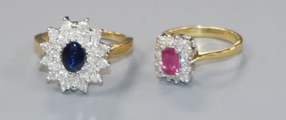 An 18ct gold, sapphire and diamond cluster ring and an 18ct gold, emerald-cut ruby and diamond