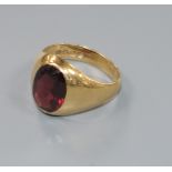 An 18ct gold and red paste set signet ring, size J/K