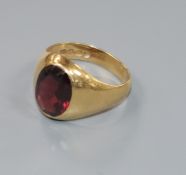 An 18ct gold and red paste set signet ring, size J/K