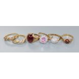 Five 9ct gold rings and one 10ct ring, including a gentleman's cabochon garnet set-ring, an