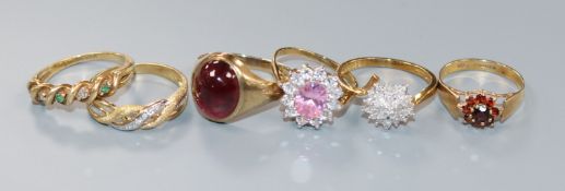 Five 9ct gold rings and one 10ct ring, including a gentleman's cabochon garnet set-ring, an