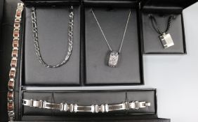 A group of assorted modern Tusk steel jewellery including bracelets and pendants.