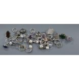 A quantity of assorted dress rings including 925 and a pair of earrings.