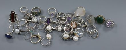 A quantity of assorted dress rings including 925 and a pair of earrings.