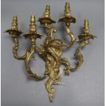 A brass five branch candelabra wall light