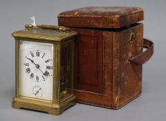 A cased carriage timepiece with alarm