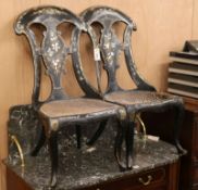 A pair of papier mache seated chairs