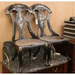 A pair of papier mache seated chairs