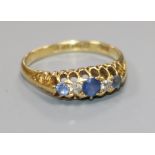 An early 20th century 18ct gold diamond and sapphire ring, size Q.