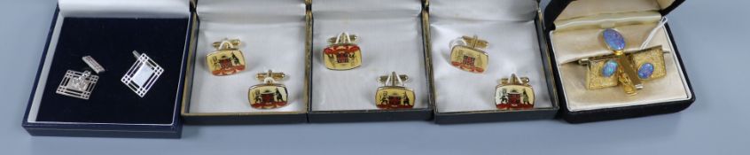 A pair of pierced silver cufflinks and four other pairs of metal cufflinks including opal pair