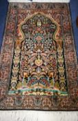 A Kashan print silk rug 124cm x 79cm